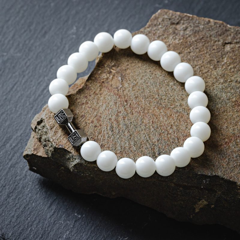 Power dumbbell bracelet with lustrous white natural stone beads and a titanium-steel dumbbell centerpiece